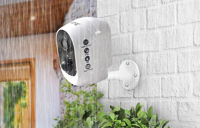 wireless security camera mounted, in the rain